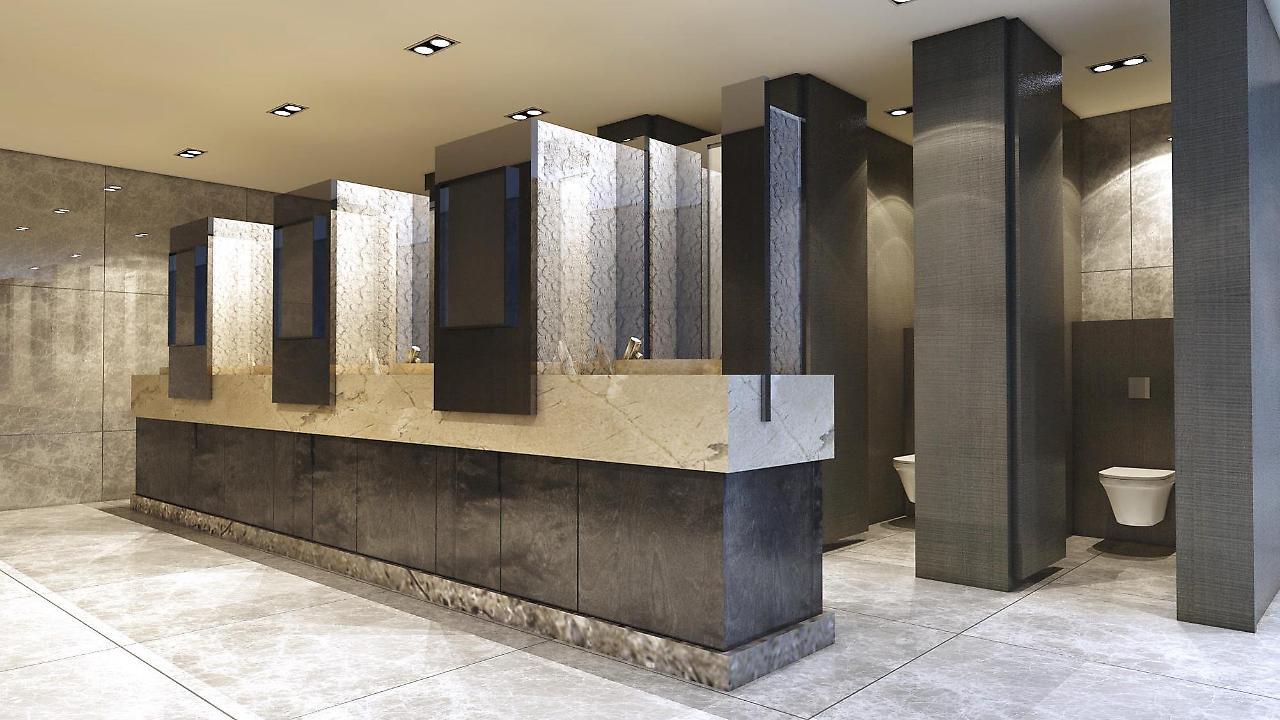 Hotel Caesar Metro Taipei Extérieur photo The photo depicts the interior of a modern restroom. It features a sleek design with a counter that includes several sinks and mirrors. The materials used appear to be a mix of stone and dark finishes, contributing to a contemporary aesthetic. There 